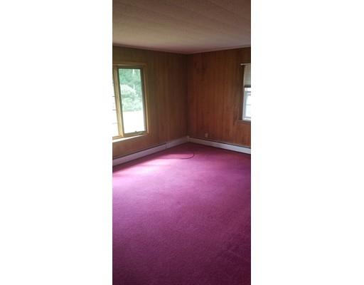 176 Rice Corner Road Brookfield, MA 01506 - Photo 4 of 18 a view of an empty room with windows