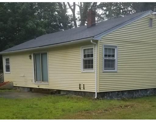 176 Rice Corner Road Brookfield, MA 01506 - Photo 10 of 18 a view of a white house with a yard