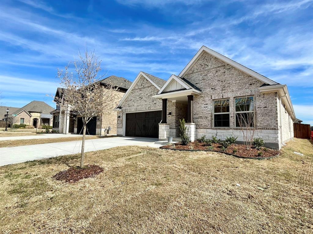 13705 Riola Drive Little Elm, TX 75068 - Photo 2 of 40 a front view of a house with a yard