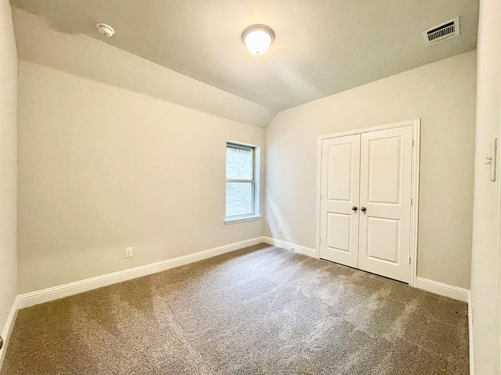 13705 Riola Drive Little Elm, TX 75068 - Photo 24 of 40 a view of an empty room with a window