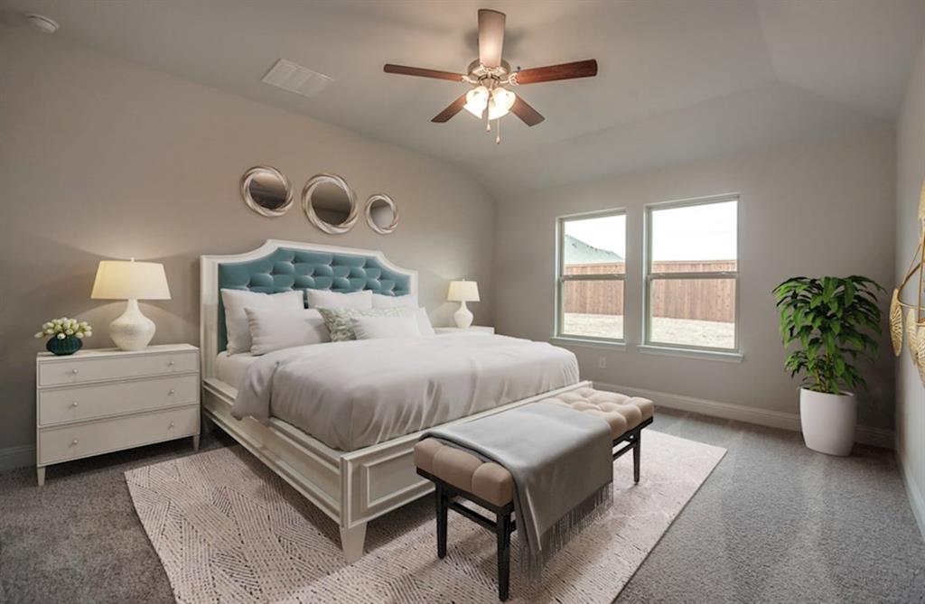 13705 Riola Drive Little Elm, TX 75068 - Photo 30 of 40 a spacious bedroom with a bed and a chandelier