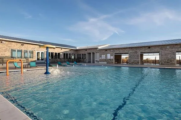 a view of swimming pool with seating area