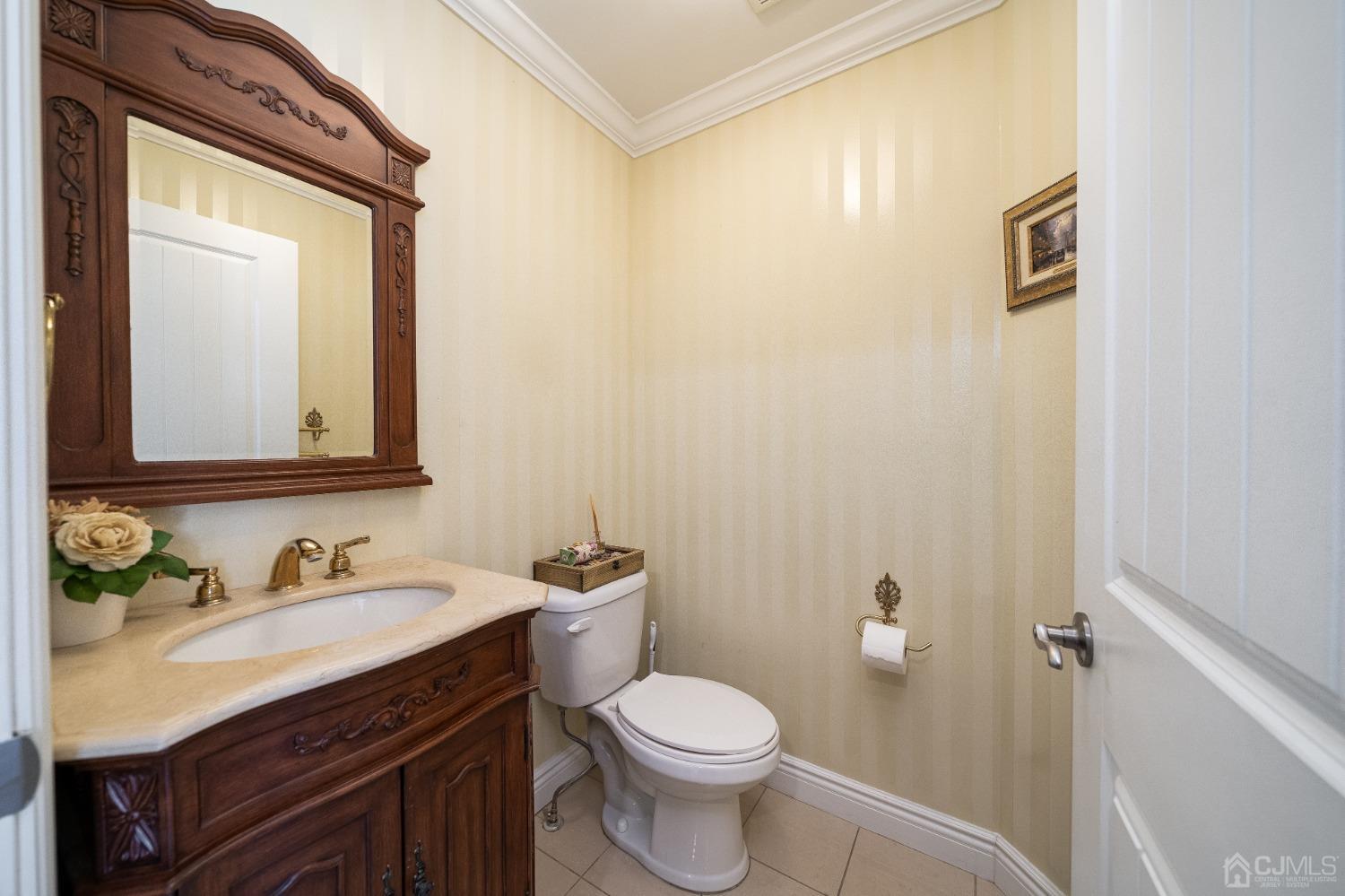 5 Glen Gary Road Middlesex, NJ 08846 - Photo 14 of 37 a bathroom with a toilet sink vanity and mirror