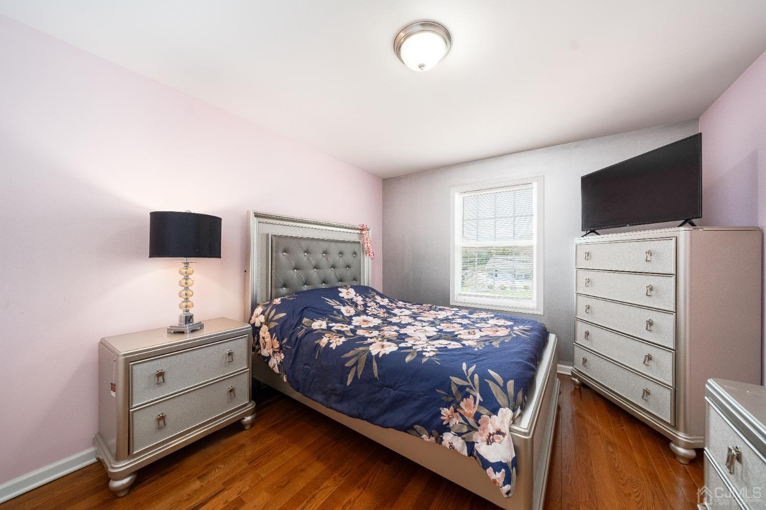 5 Glen Gary Road Middlesex, NJ 08846 - Photo 15 of 37 a bedroom with a bed and a flat screen tv