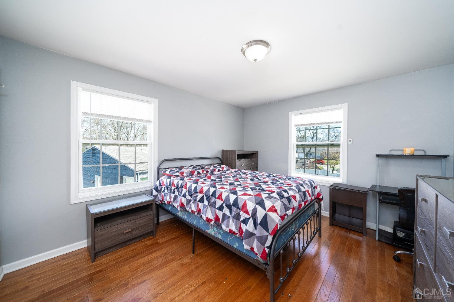 5 Glen Gary Road Middlesex, NJ 08846 - Photo 16 of 37 a bedroom with a bed a table and windows