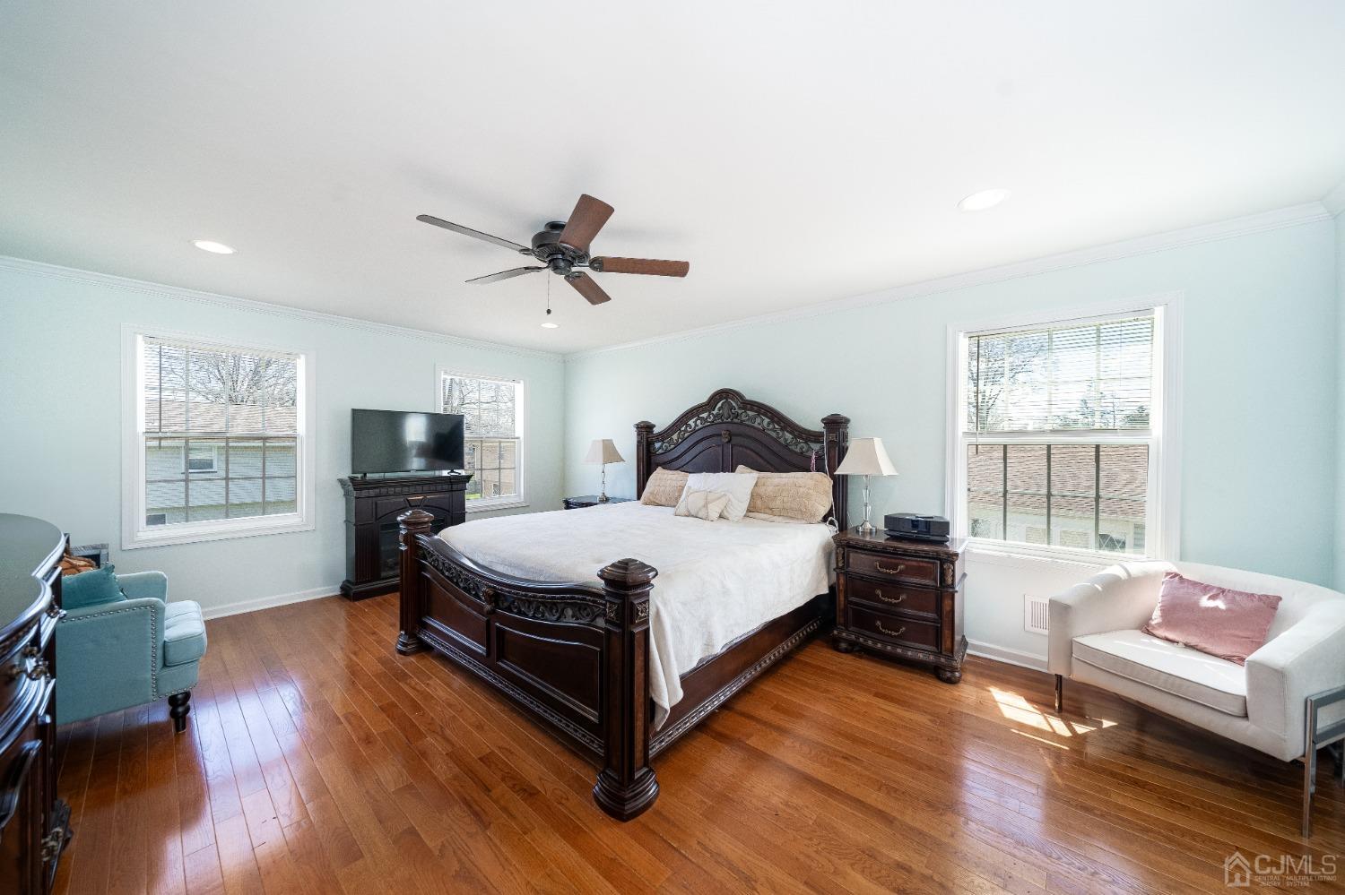 5 Glen Gary Road Middlesex, NJ 08846 - Photo 20 of 37 a spacious bedroom with a bed a chandelier and a window