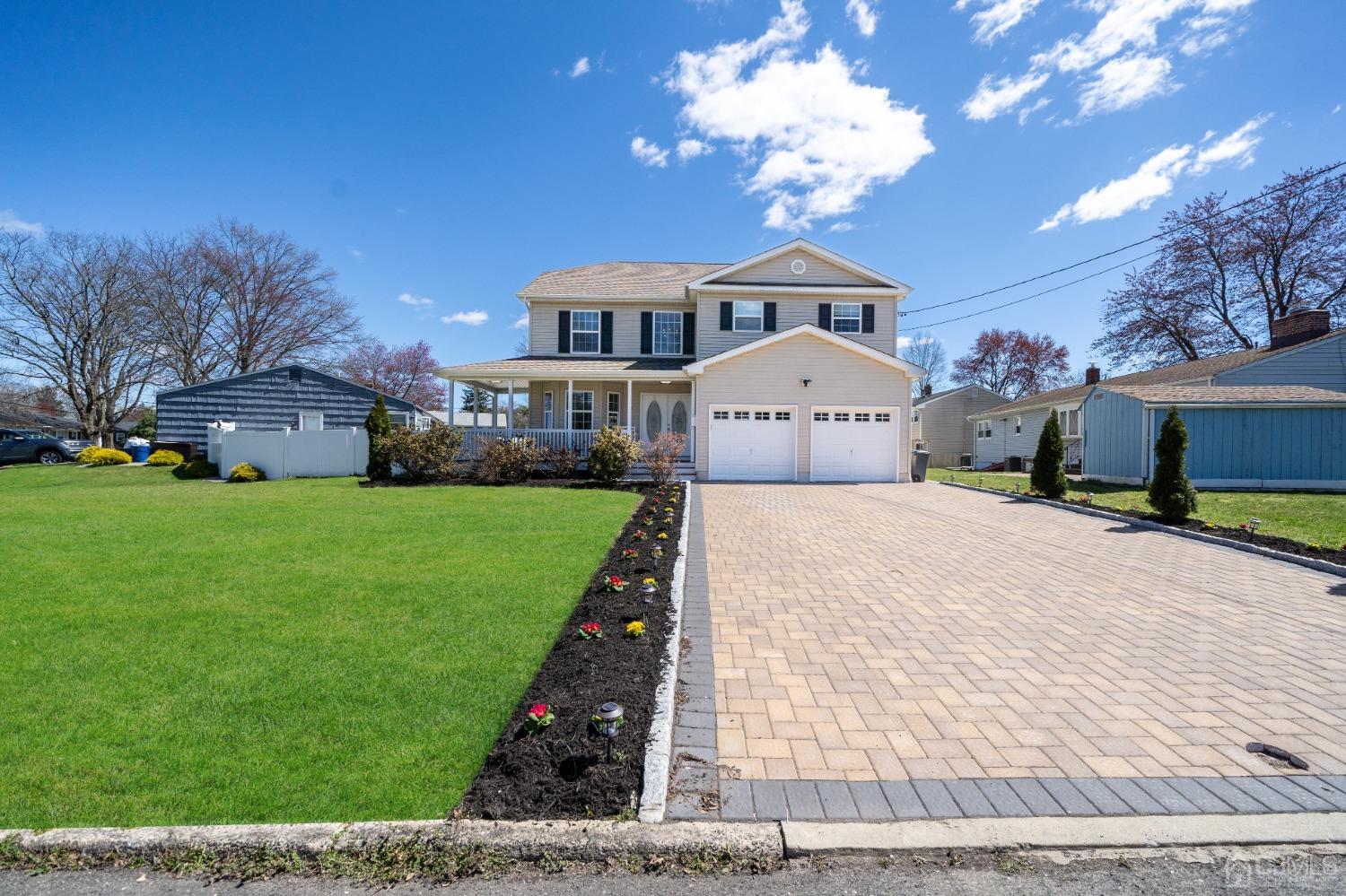 5 Glen Gary Road Middlesex, NJ 08846 - Photo 2 of 37 a front view of a house with a yard and garage
