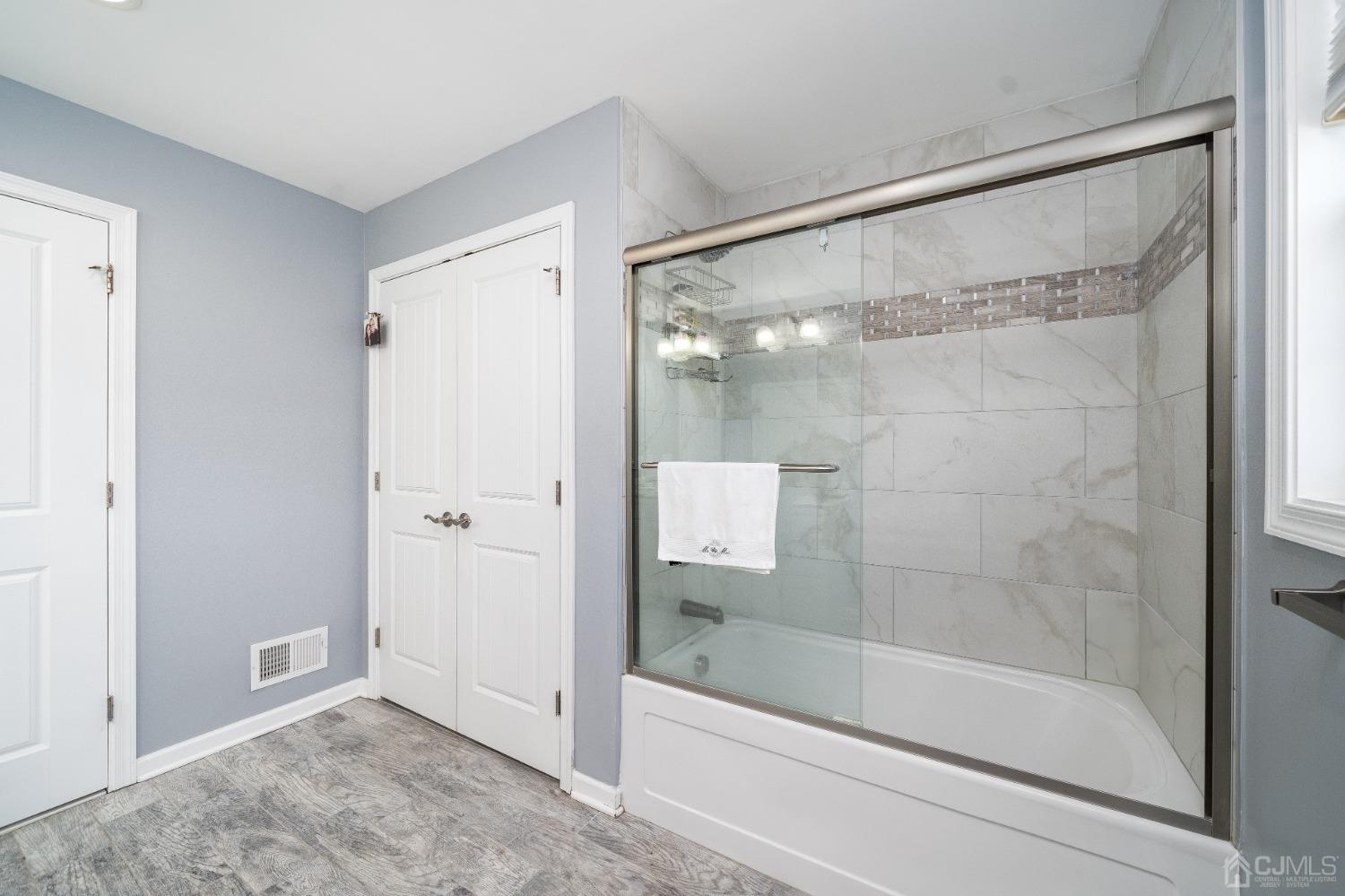 5 Glen Gary Road Middlesex, NJ 08846 - Photo 23 of 37 a bathroom with a glass shower door