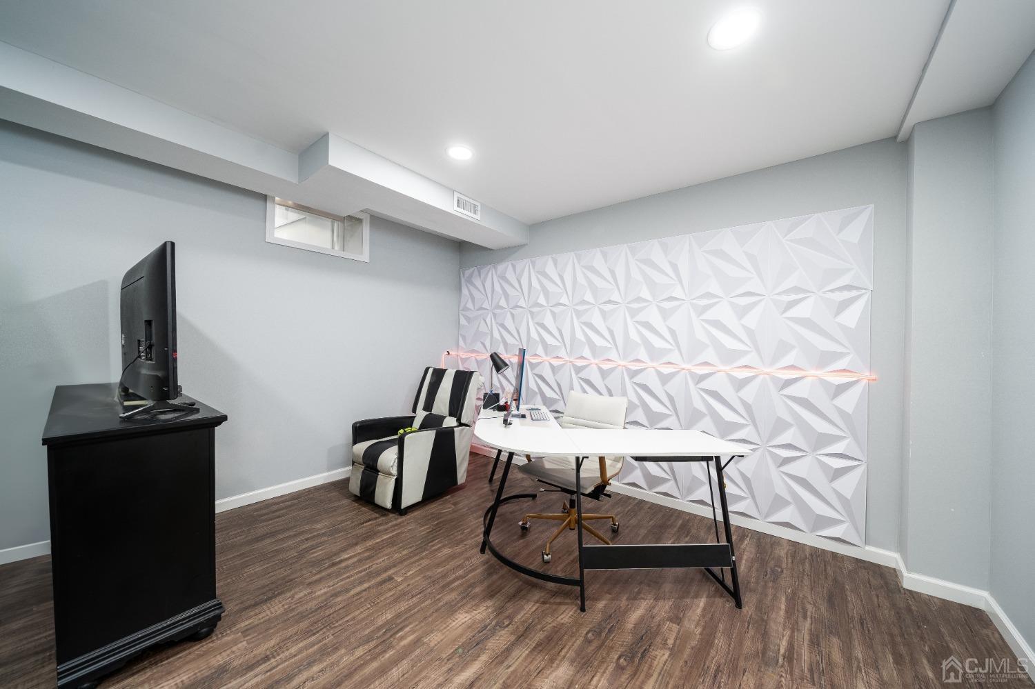 5 Glen Gary Road Middlesex, NJ 08846 - Photo 26 of 37 a view of a room with gym equipment and wooden floor