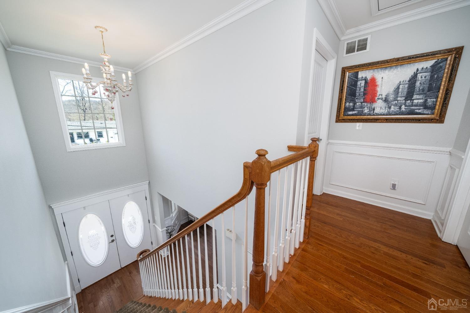 5 Glen Gary Road Middlesex, NJ 08846 - Photo 4 of 37 a view of a hallway with wooden floor and staircase
