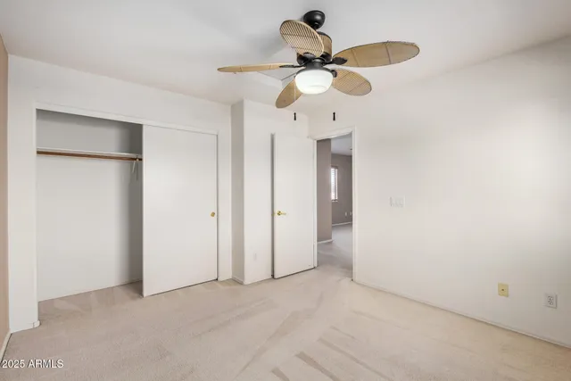 a view of a chandelier fan and a refrigerator