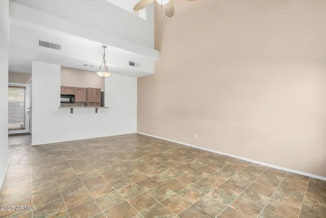 a view of a kitchen with a dishwasher and a refrigerator