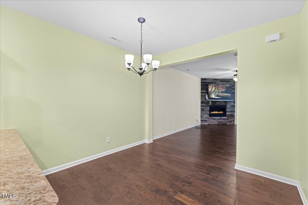 106 Churment Court Durham, NC 27703 - Photo 15 of 50 a view of a livingroom with a chandelier