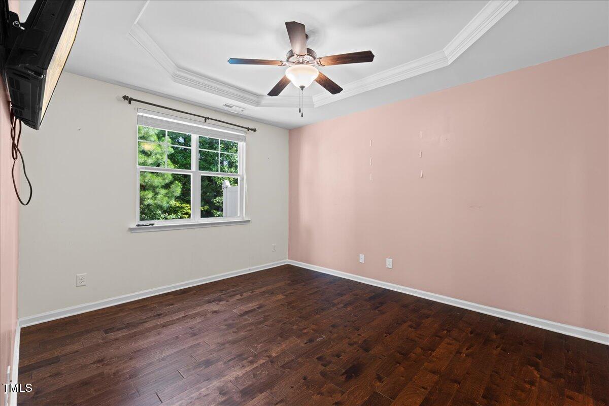 106 Churment Court Durham, NC 27703 - Photo 21 of 50 an empty room with wooden floor and windows