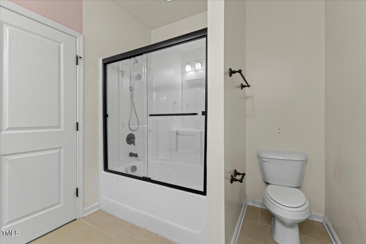 106 Churment Court Durham, NC 27703 - Photo 26 of 50 a white toilet sitting next to a bathroom