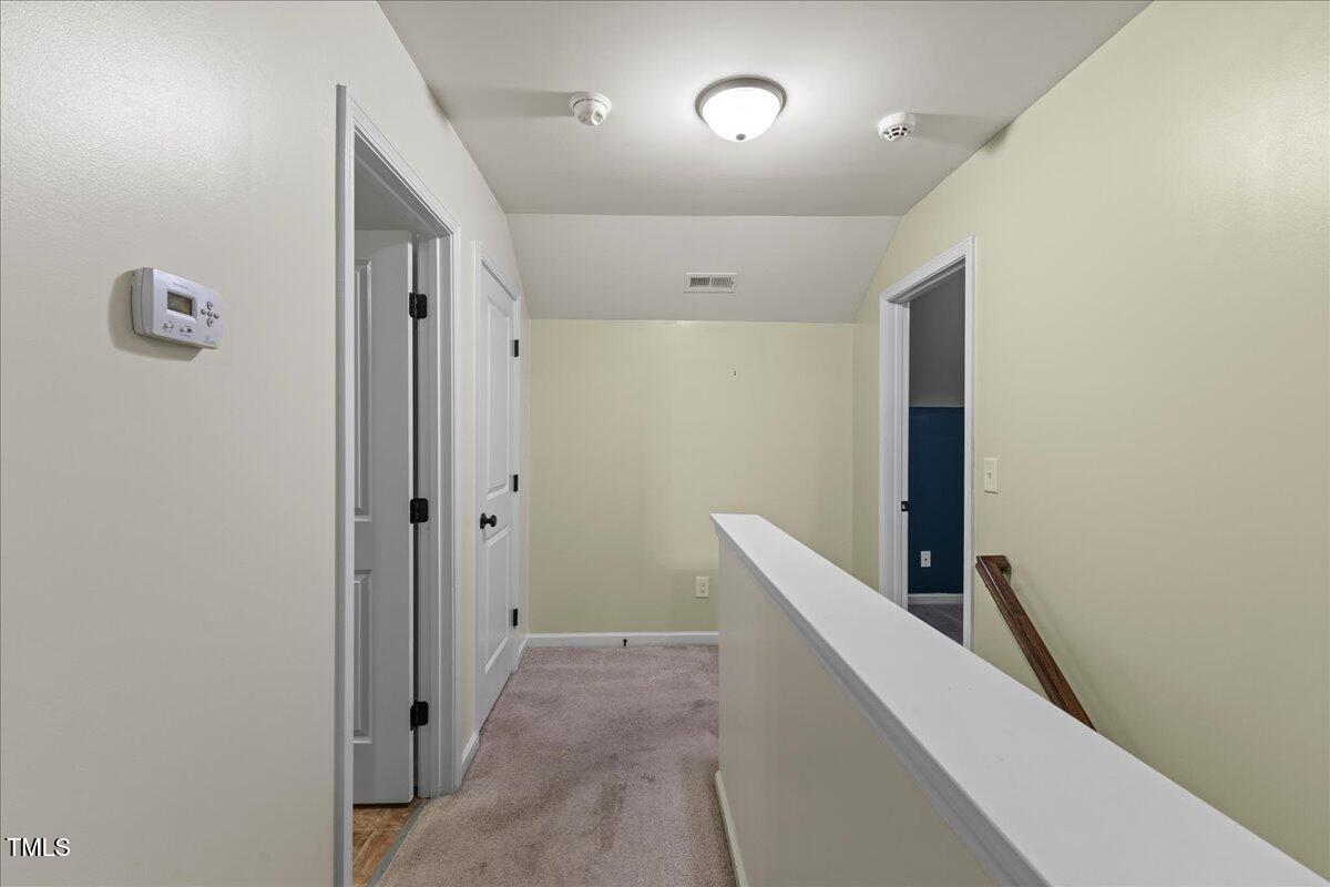 106 Churment Court Durham, NC 27703 - Photo 30 of 50 a view of hallway with stairs