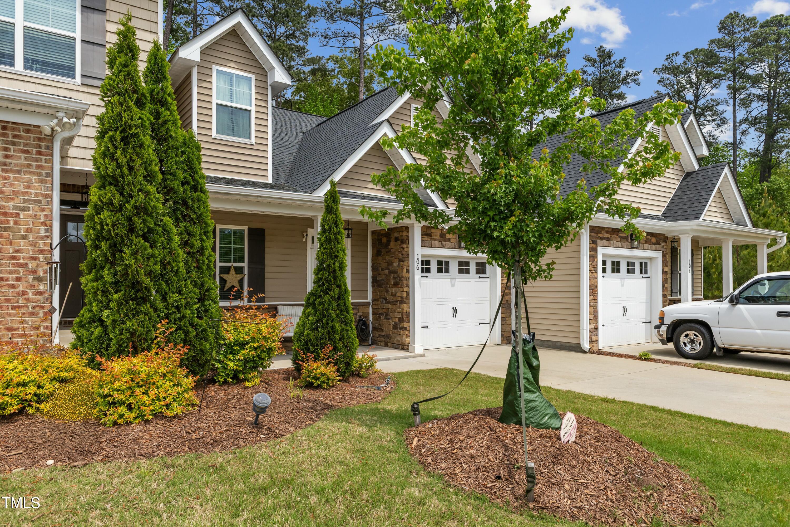 106 Churment Court Durham, NC 27703 - Photo 3 of 50 a view of a house with a yard