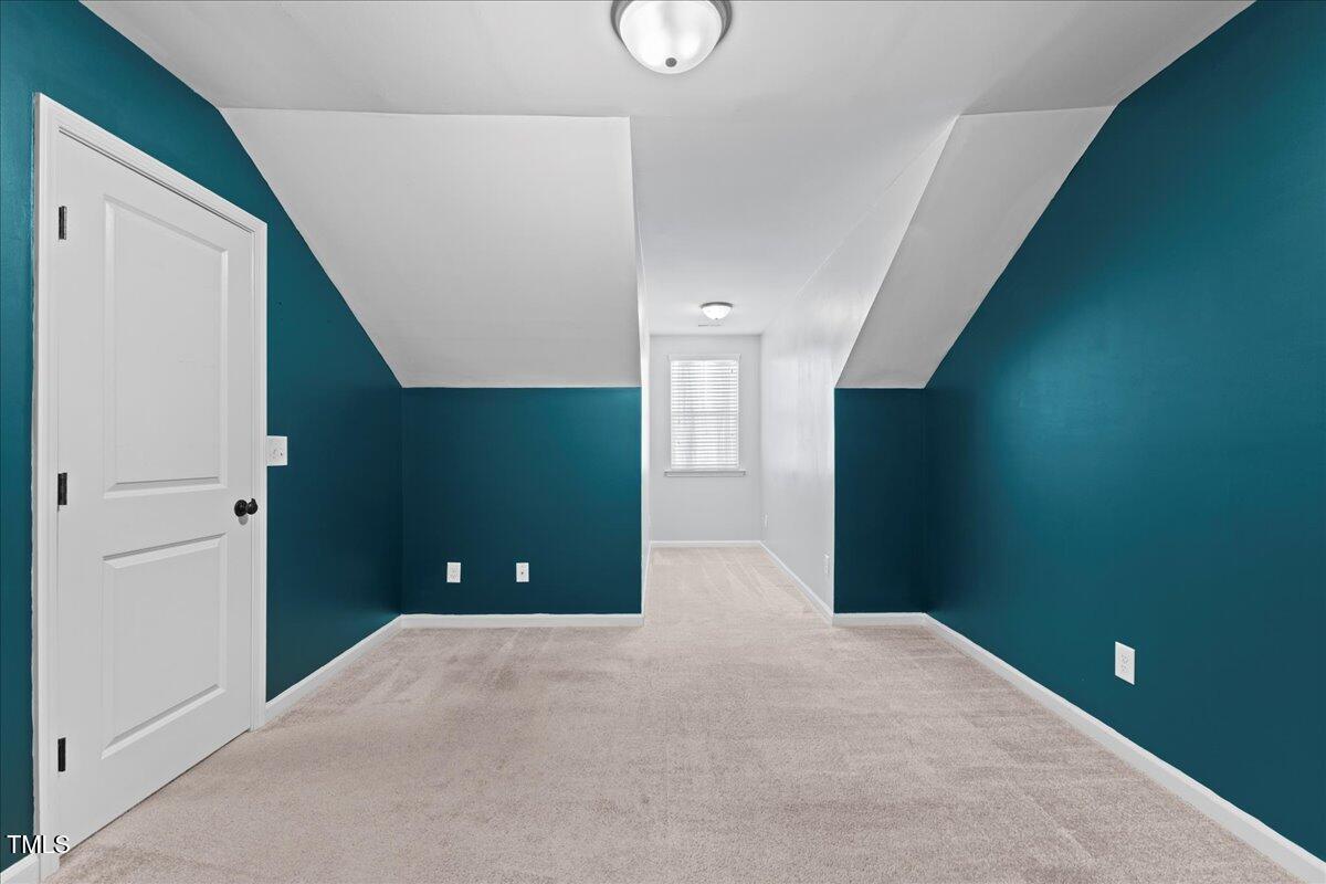 106 Churment Court Durham, NC 27703 - Photo 32 of 50 a bedroom with closet and window