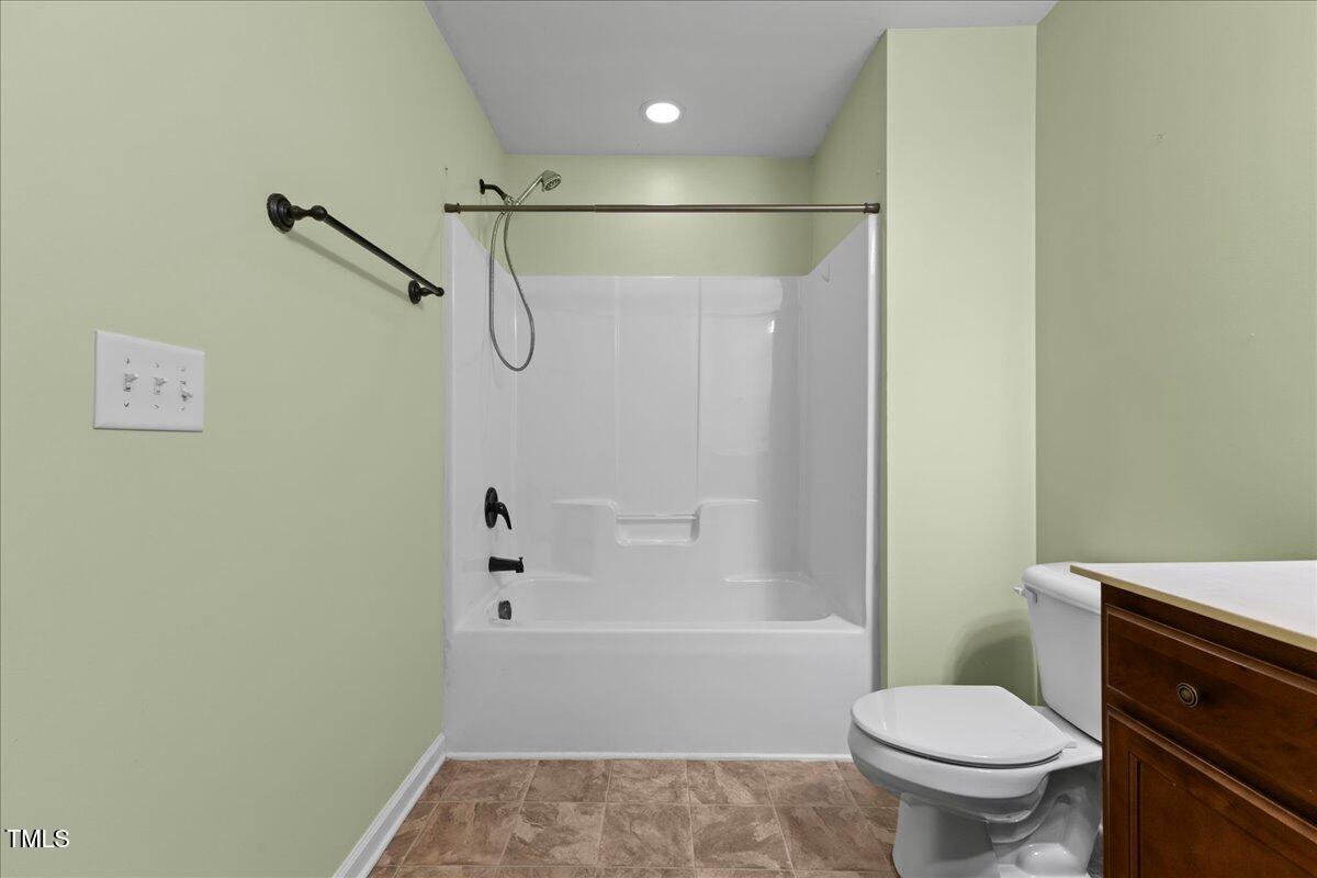 106 Churment Court Durham, NC 27703 - Photo 36 of 50 a bathroom with a toilet and a shower