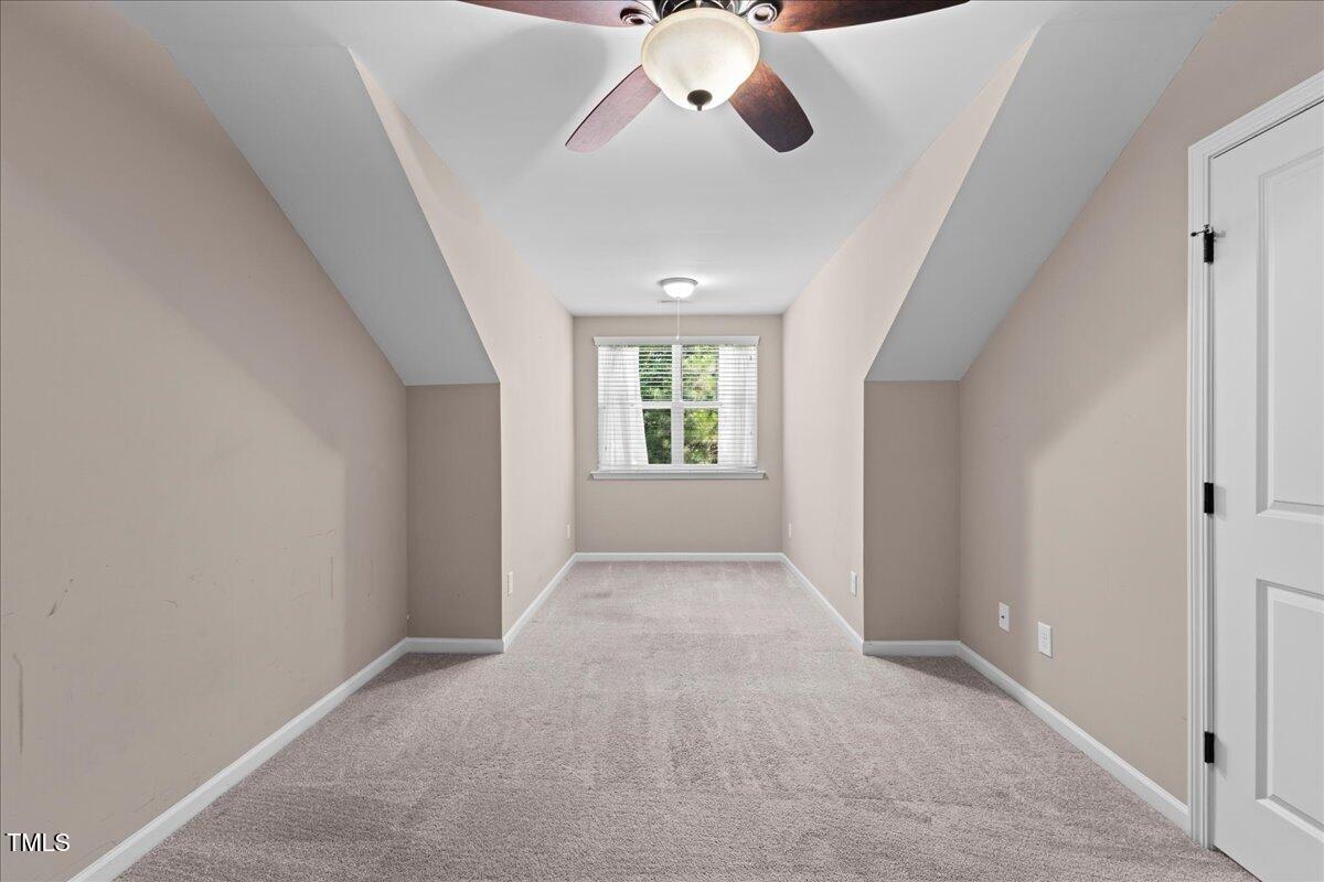 106 Churment Court Durham, NC 27703 - Photo 38 of 50 a view of a livingroom with a ceiling fan and window