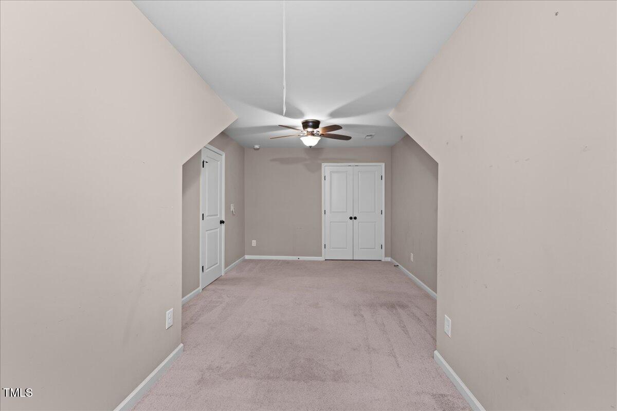 106 Churment Court Durham, NC 27703 - Photo 39 of 50 an empty room with a ceiling fan and a fan