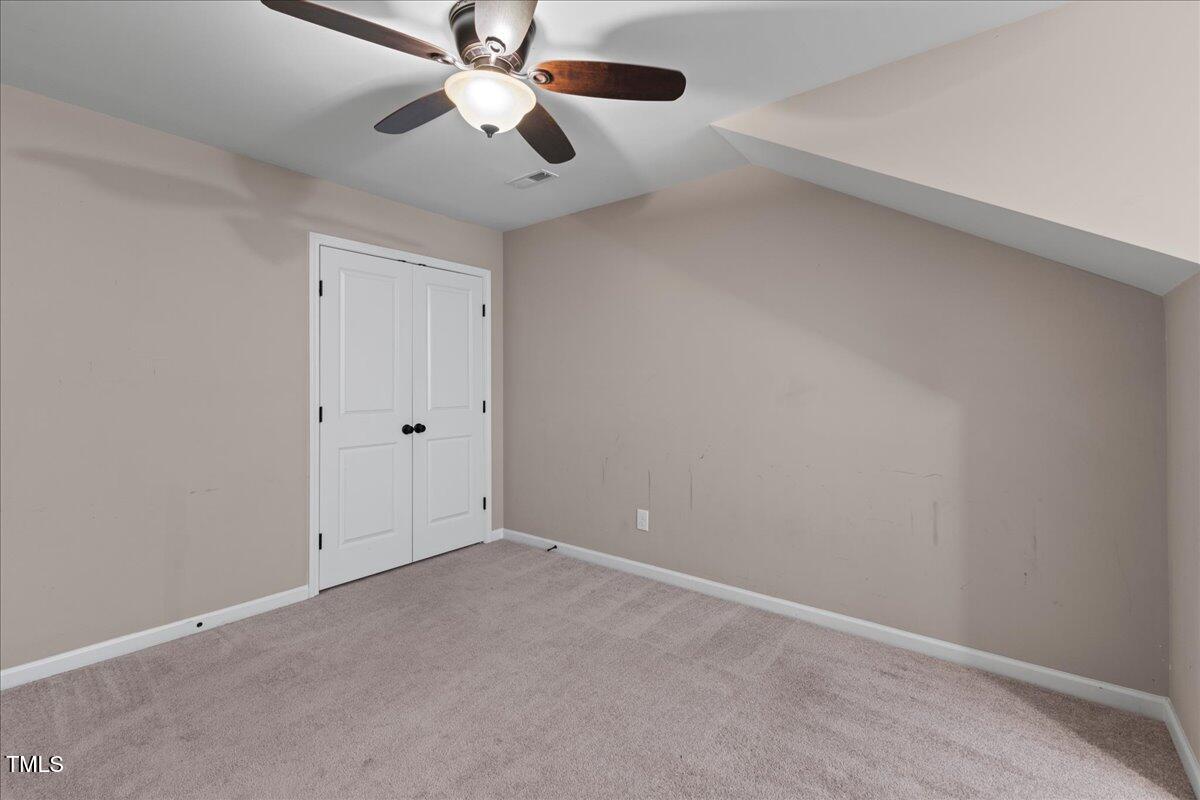 106 Churment Court Durham, NC 27703 - Photo 40 of 50 an empty room with chandelier fan