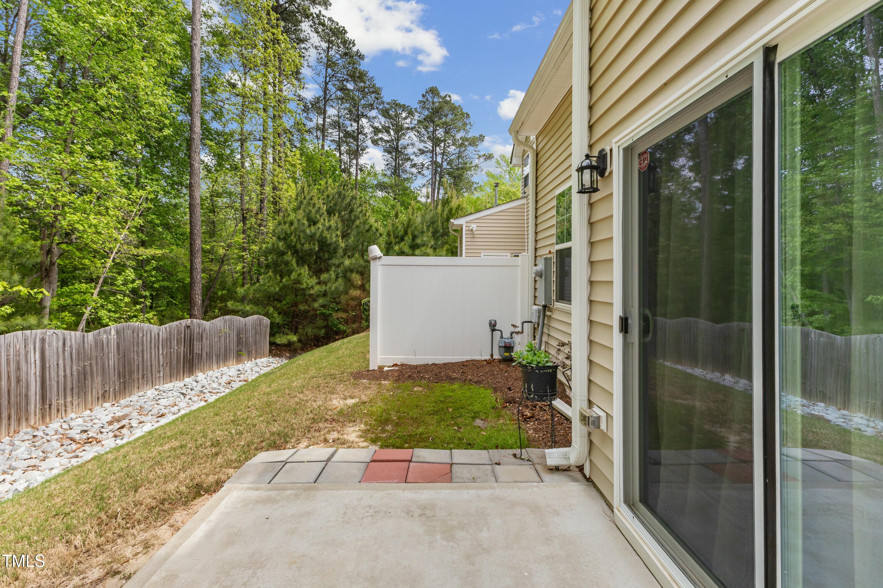 106 Churment Court Durham, NC 27703 - Photo 42 of 50 a view of a back yard of the house