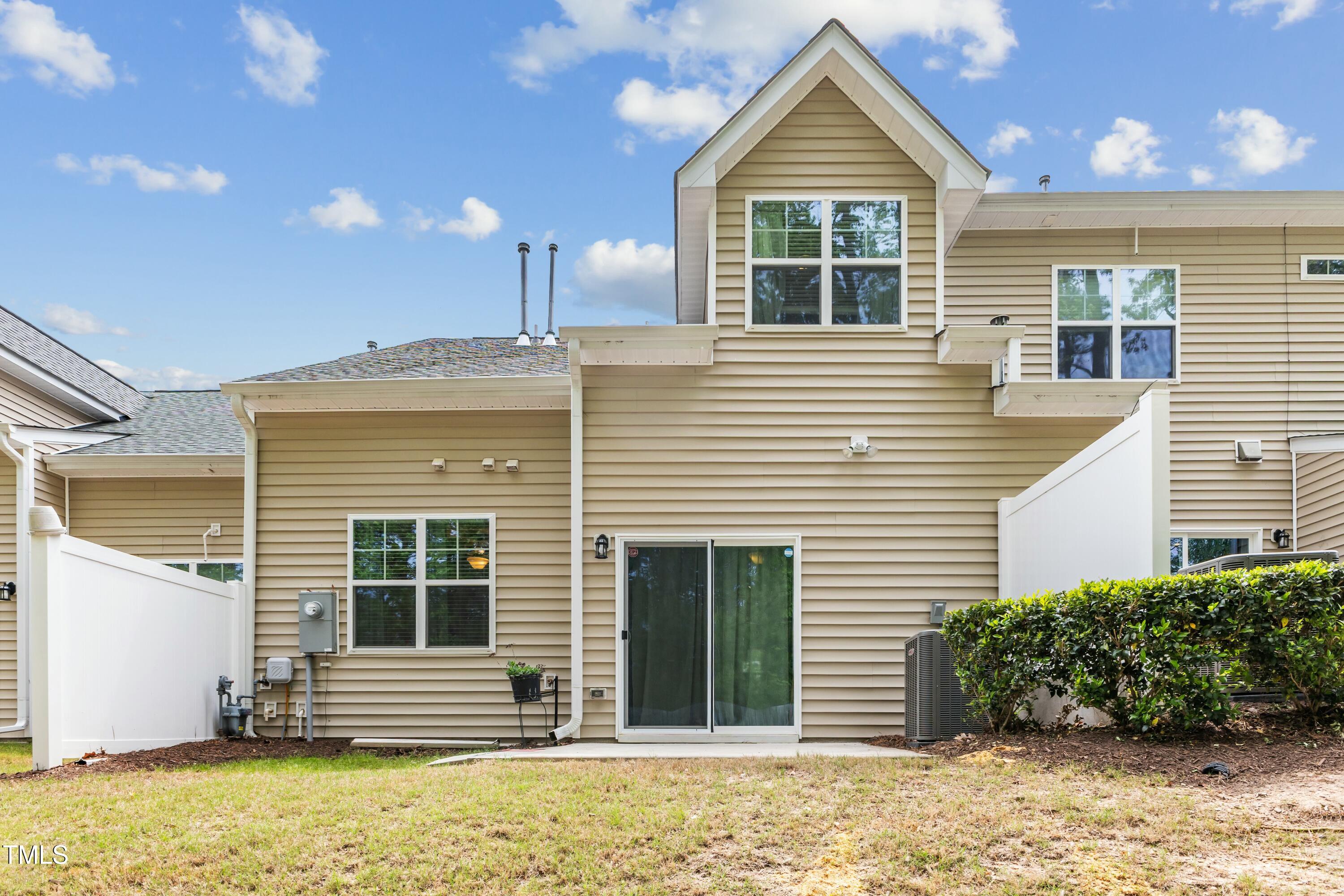 106 Churment Court Durham, NC 27703 - Photo 45 of 50 a view of a house with a window and brick walls
