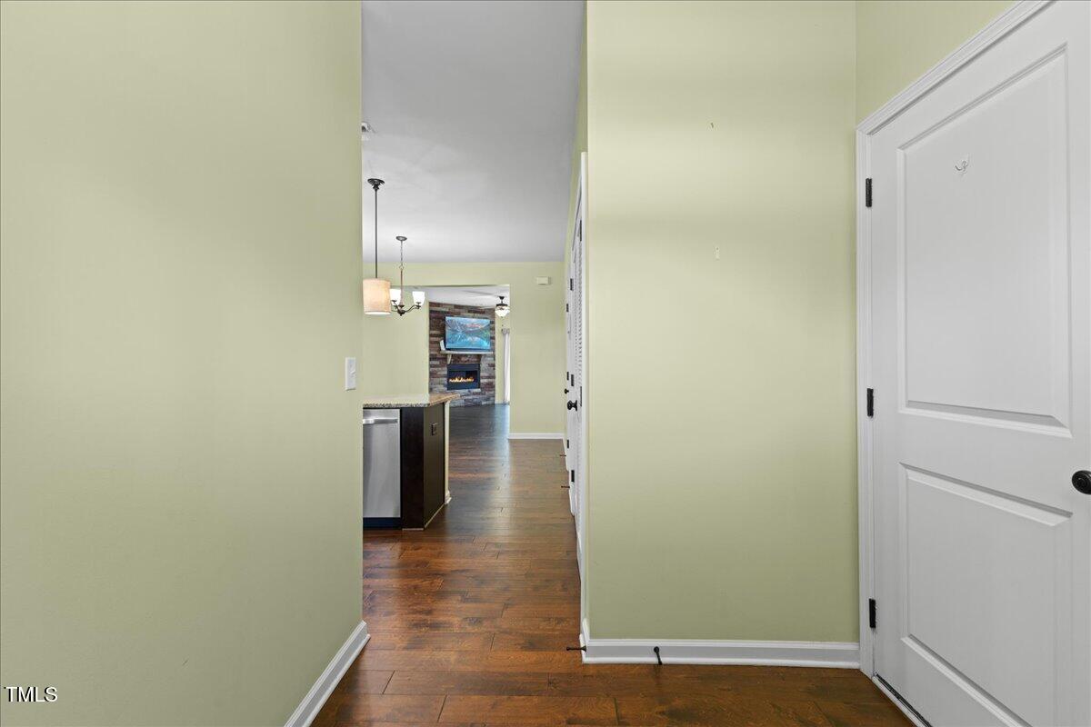106 Churment Court Durham, NC 27703 - Photo 7 of 50 a view of a hallway with wooden floor and staircase