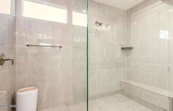 a bathroom with a shower and toilet