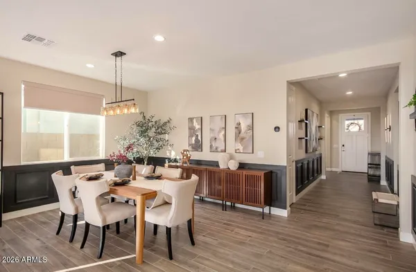 a view of a dining room with furniture window and wooden floor