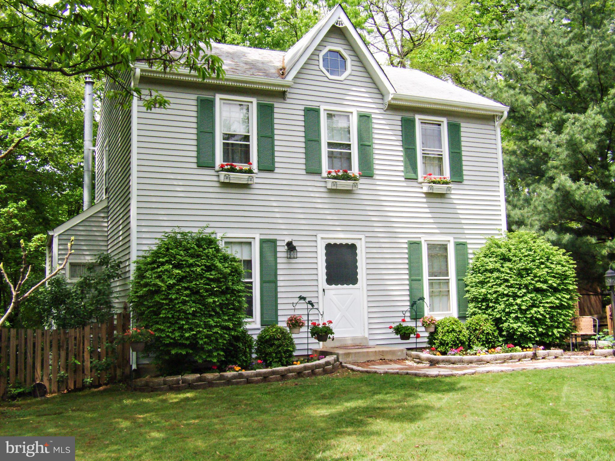 3808 Pippins Place Point of Rocks, MD 21777 - Photo 1 of 26 a front view of a house with a yard and garage