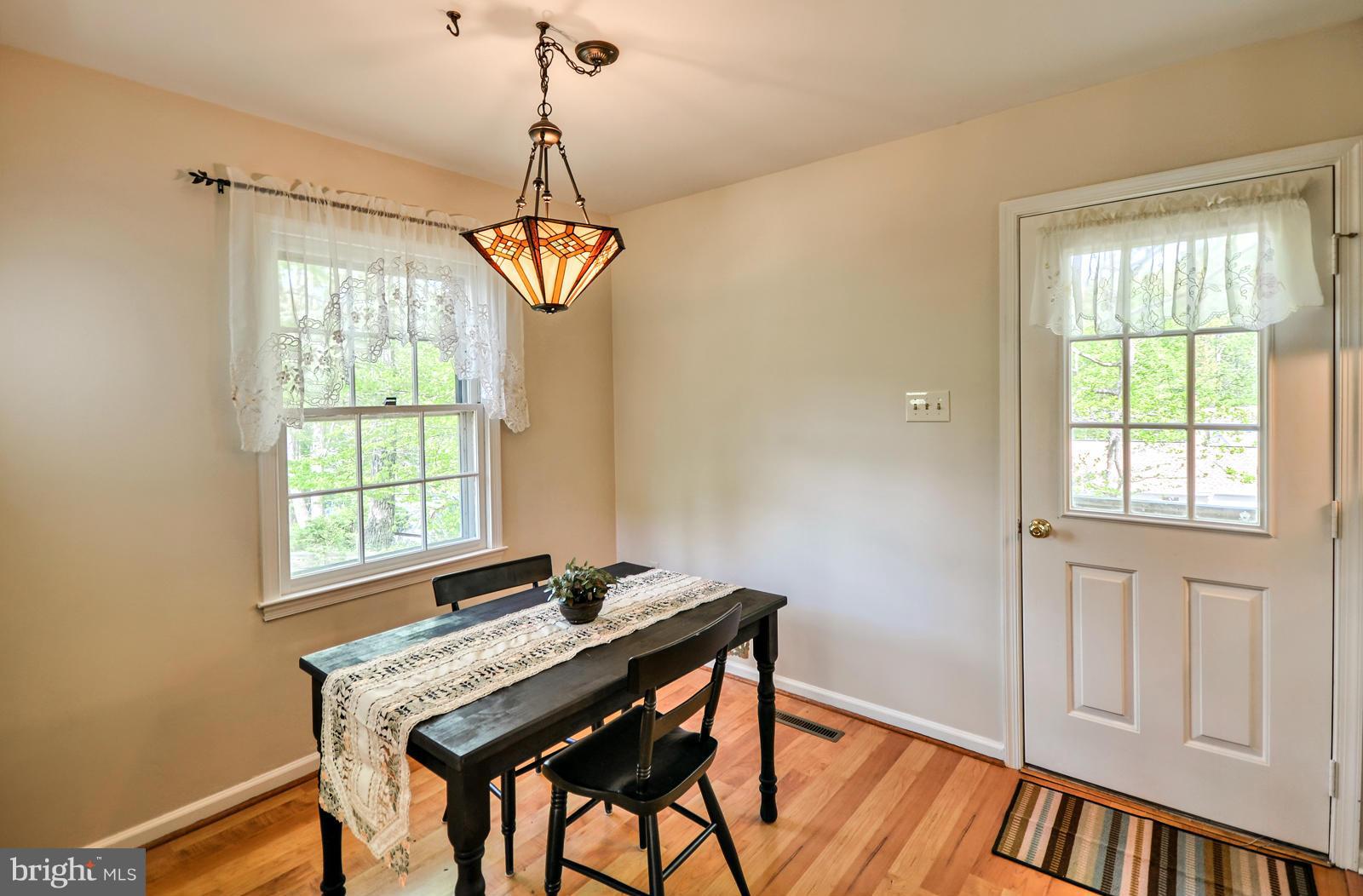 3808 Pippins Place Point of Rocks, MD 21777 - Photo 8 of 26 a dining room with window wooden floor