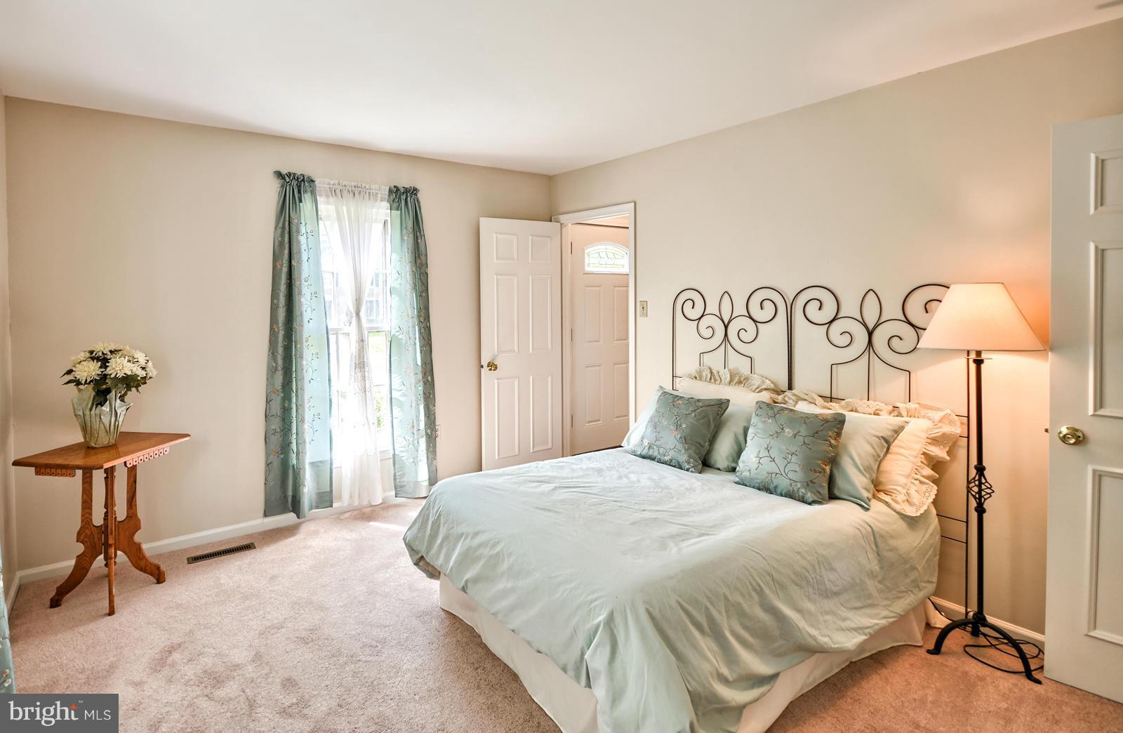 3808 Pippins Place Point of Rocks, MD 21777 - Photo 9 of 26 a bedroom with a bed and a chandelier