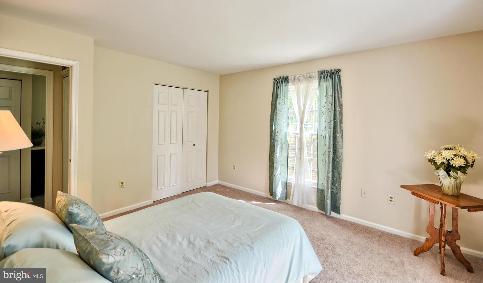 3808 Pippins Place Point of Rocks, MD 21777 - Photo 10 of 26 a bedroom with a bed and a table in it