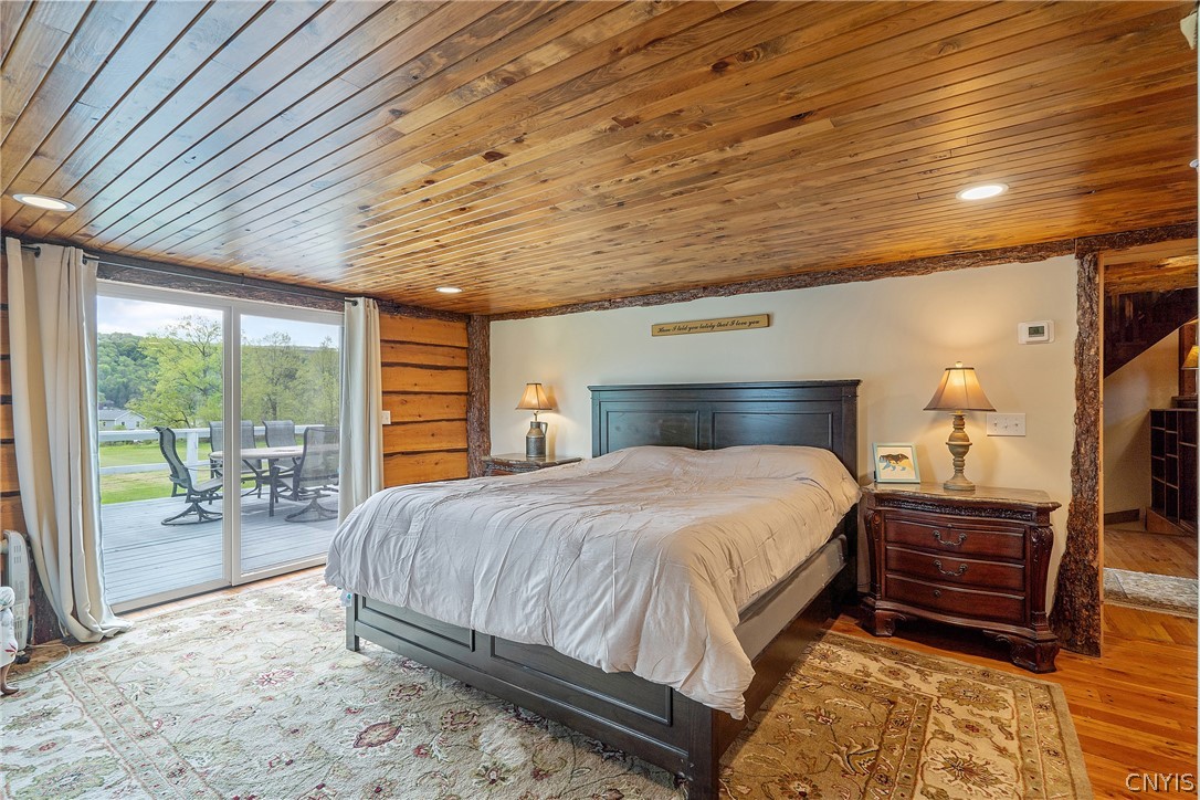 260 East Lake Road DeRuyter, NY 13052 - Photo 25 of 50 first floor primary bedroom with slider to the bac