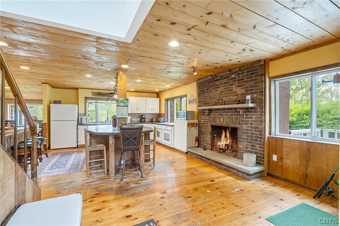 260 East Lake Road DeRuyter, NY 13052 - Photo 9 of 50 Open kitchen with woodburning fireplace