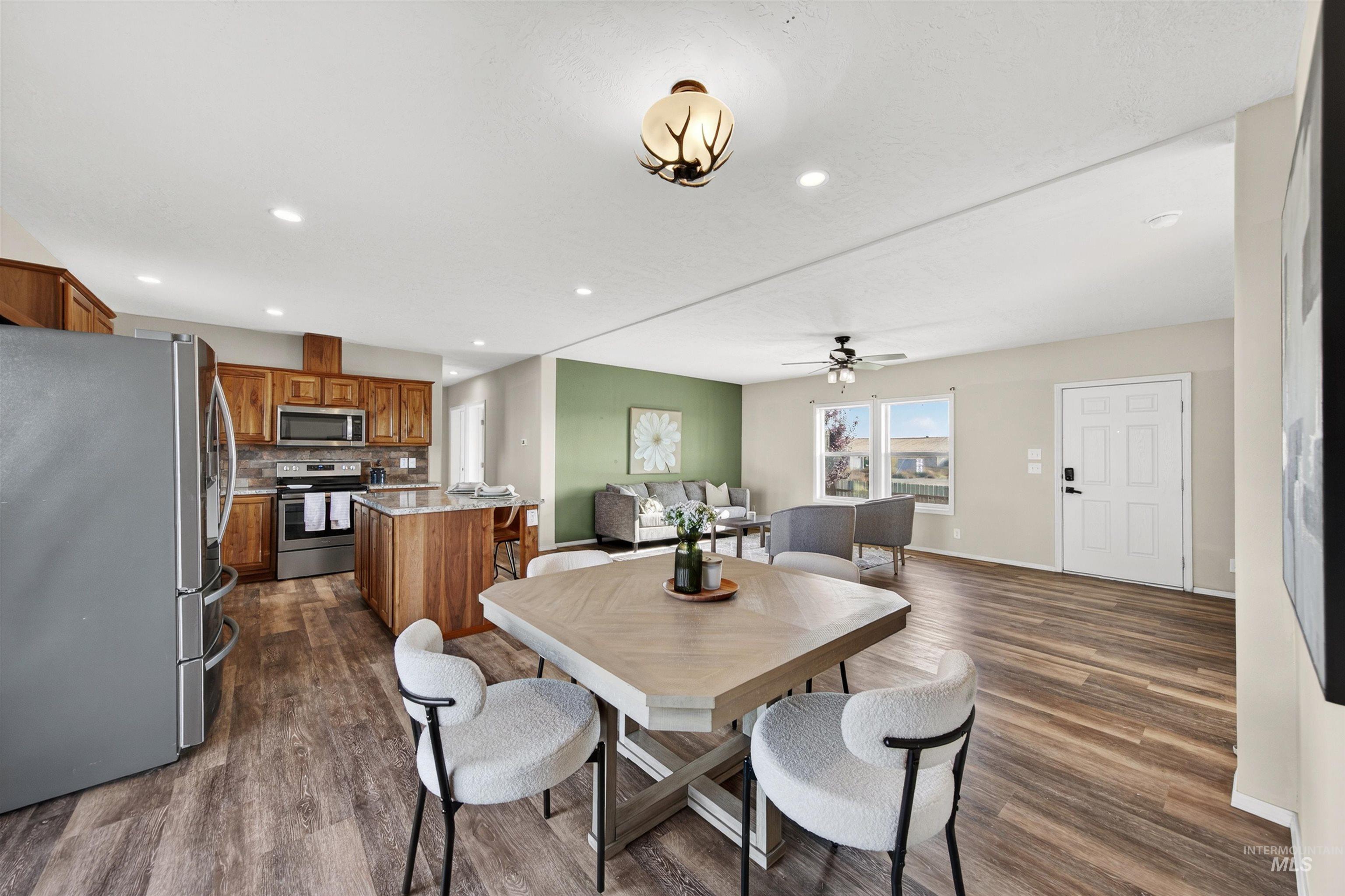 1203 Locker Avenue Parma, ID 83660 - Photo 11 of 49 Dining room featuring dark wood-style floors, recessed lighting, and a ceiling fan