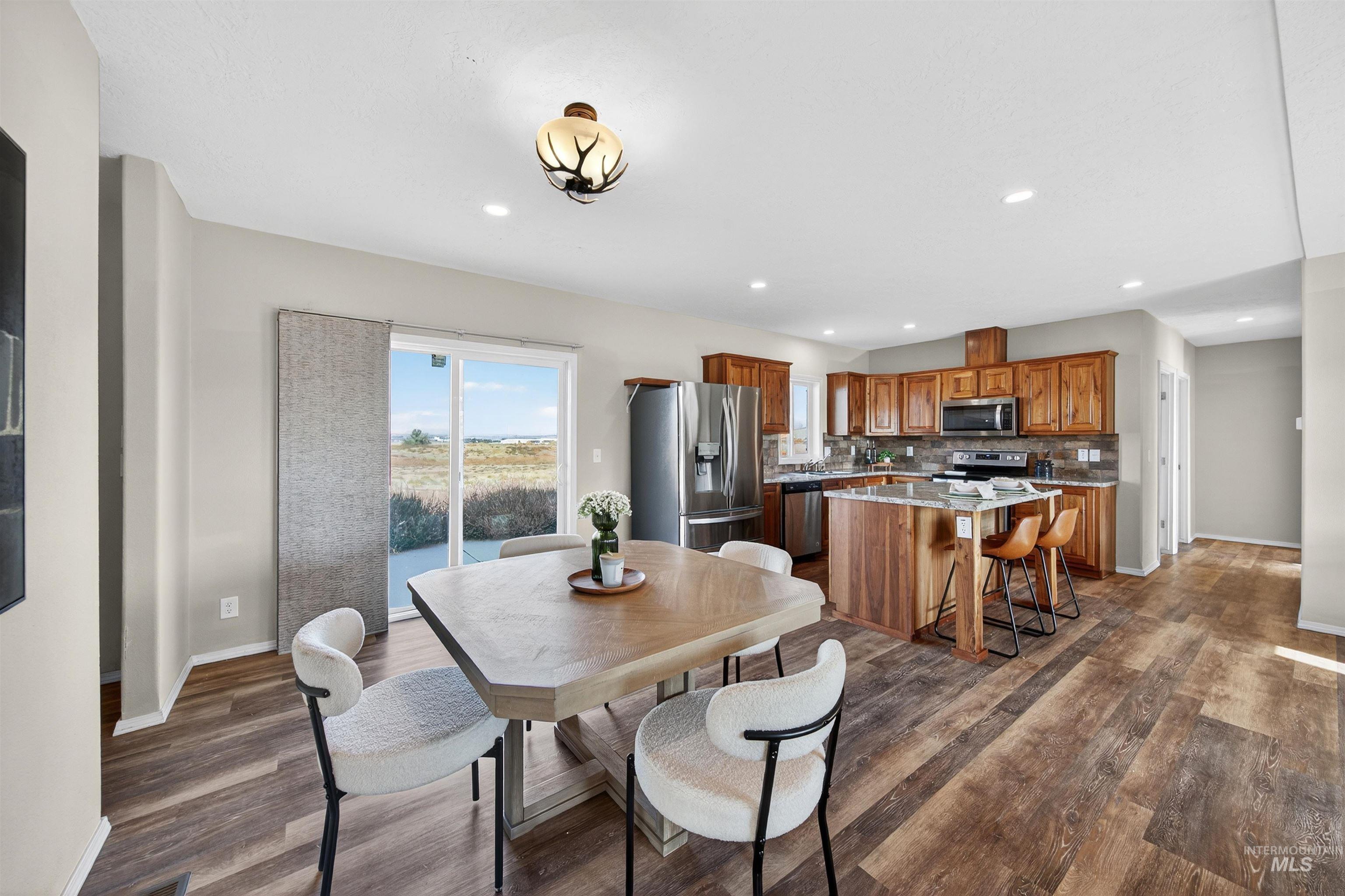 1203 Locker Avenue Parma, ID 83660 - Photo 11 of 49 Dining area with dark wood-style flooring and recessed lighting