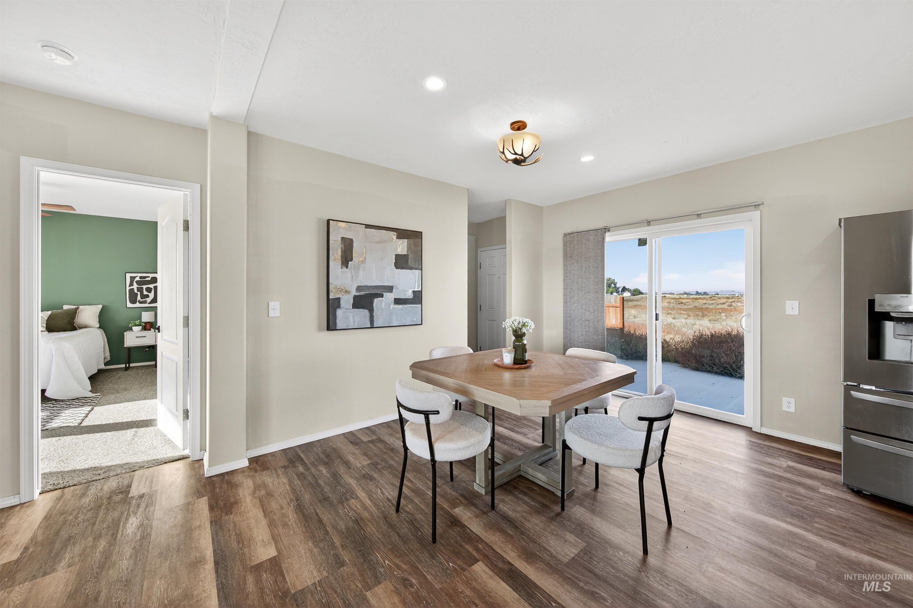 1203 Locker Avenue Parma, ID 83660 - Photo 12 of 49 Dining space featuring dark wood-style flooring and recessed lighting