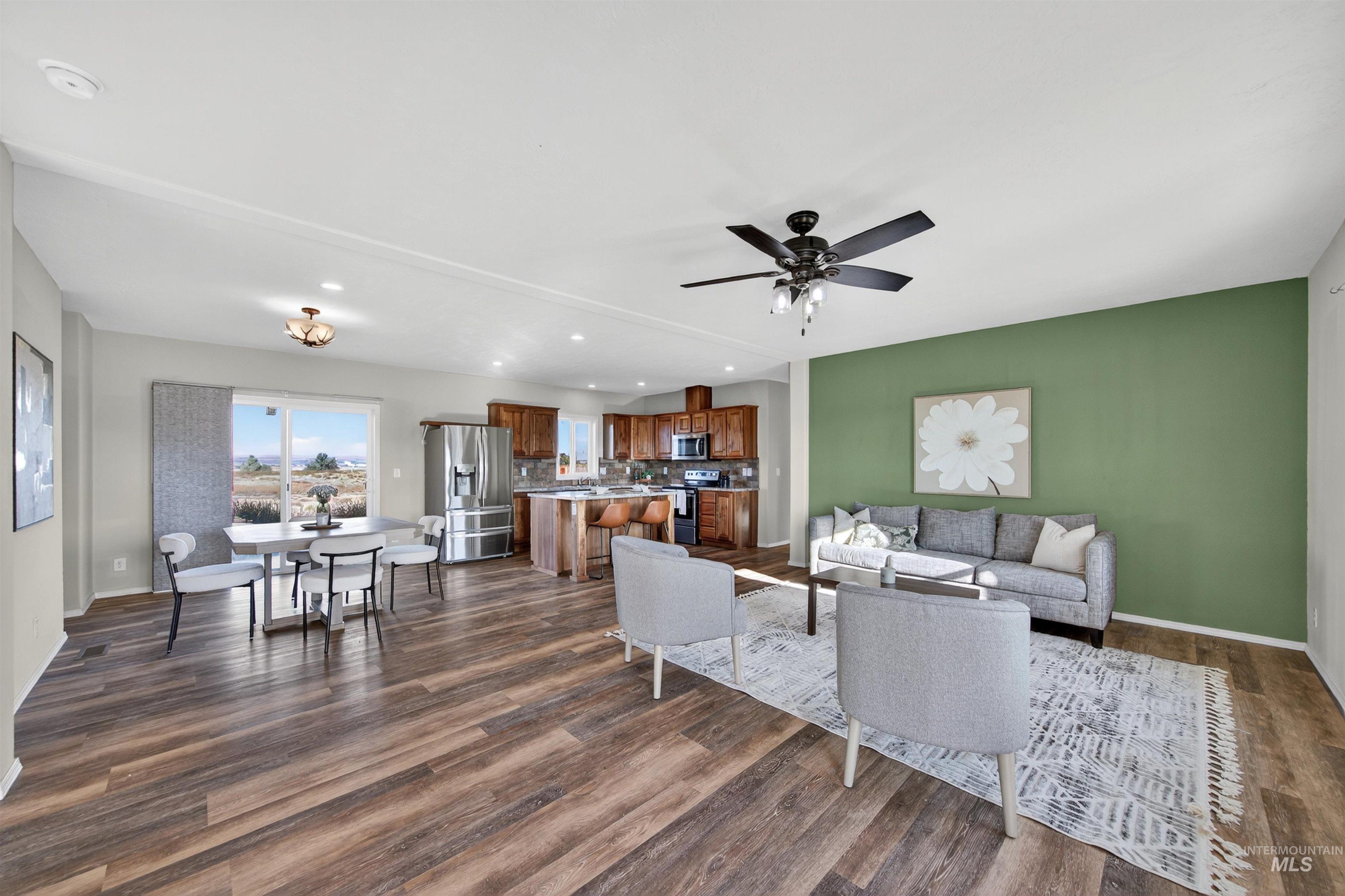 1203 Locker Avenue Parma, ID 83660 - Photo 18 of 49 Living area with recessed lighting, dark wood finished floors, and a ceiling fan