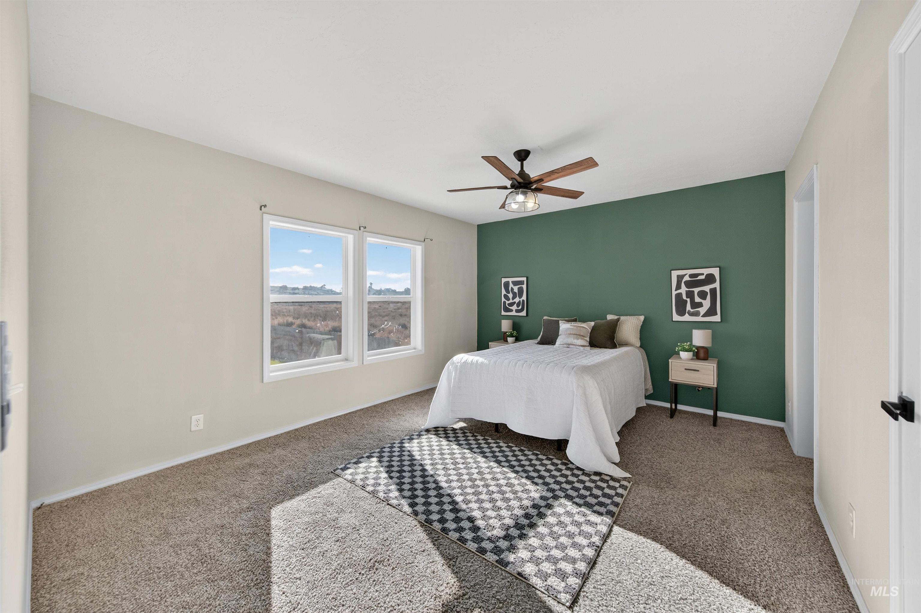 1203 Locker Avenue Parma, ID 83660 - Photo 21 of 49 Bedroom with carpet floors and ceiling fan