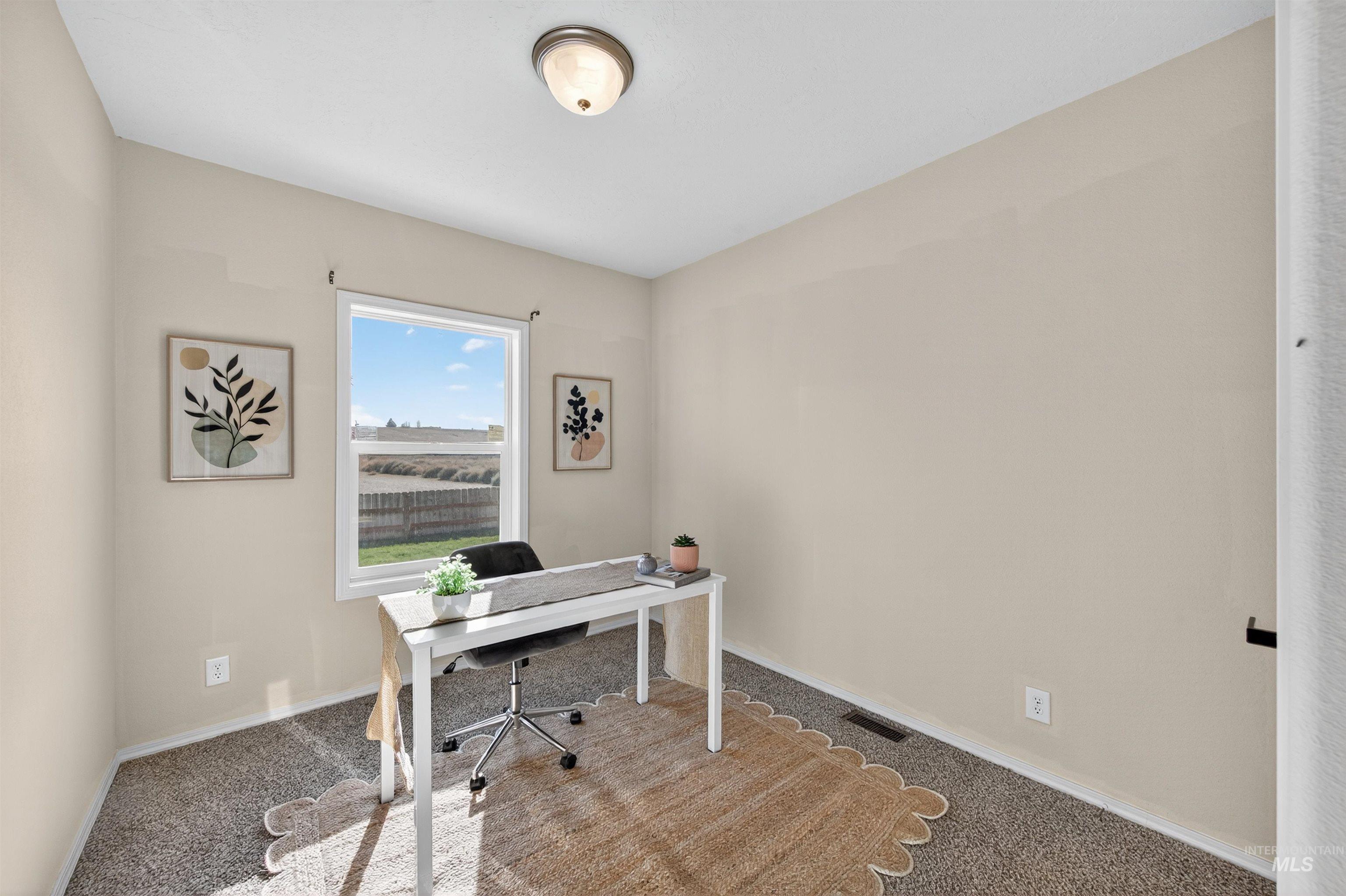 1203 Locker Avenue Parma, ID 83660 - Photo 27 of 49 Office area with carpet and baseboards