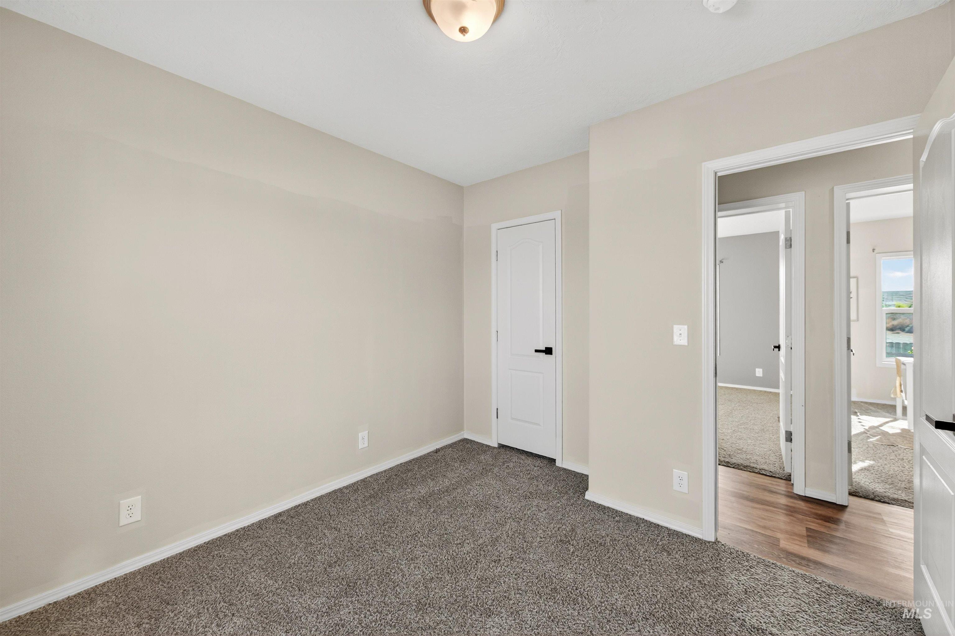 1203 Locker Avenue Parma, ID 83660 - Photo 32 of 49 Unfurnished bedroom featuring carpet floors
