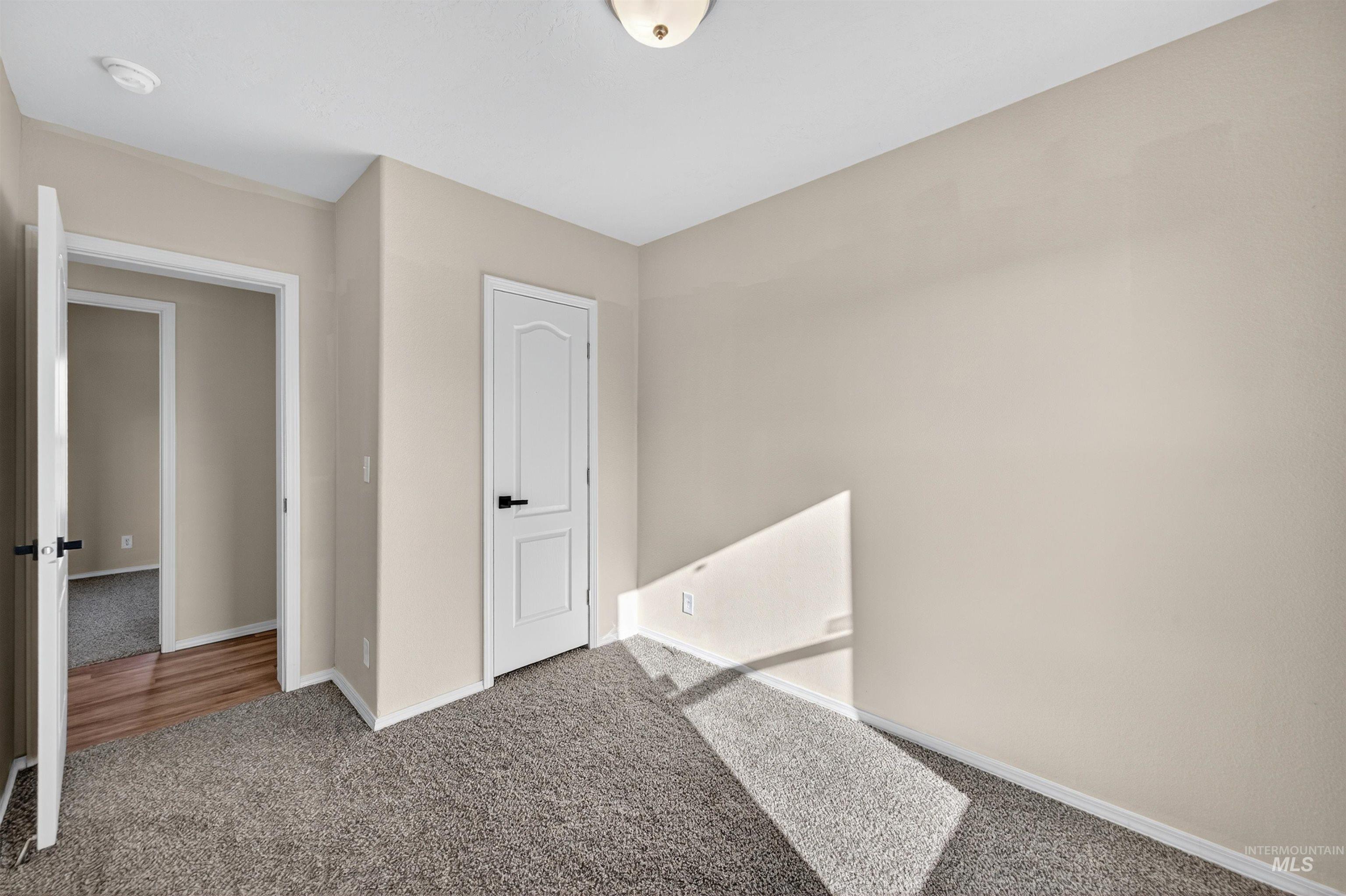 1203 Locker Avenue Parma, ID 83660 - Photo 34 of 49 Unfurnished bedroom featuring carpet floors and baseboards
