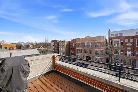 a view of a balcony with city view