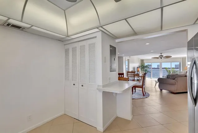 a view of a livingroom with furniture and a ceiling fan