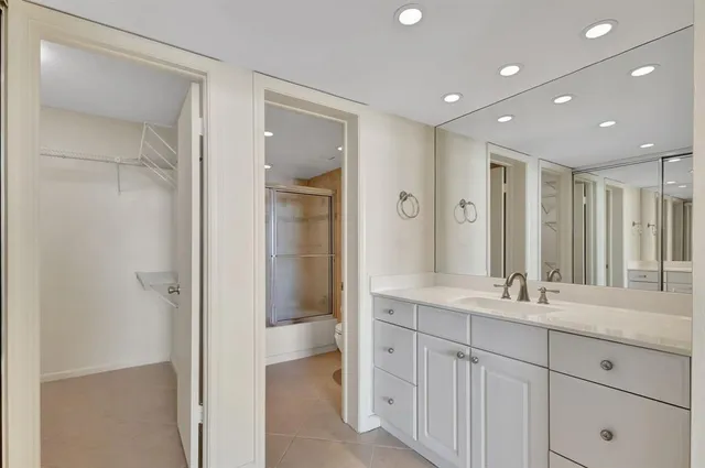 a bathroom with a double vanity sink and a mirror