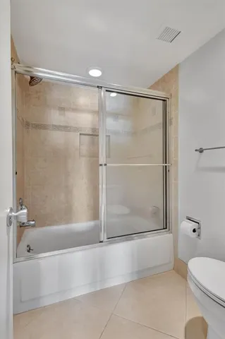 a bathroom with a shower and a toilet