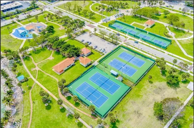 a view of fireplace with a table and chandelier